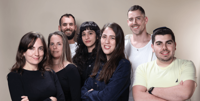 accessiBe Design team members smiling at the camera 