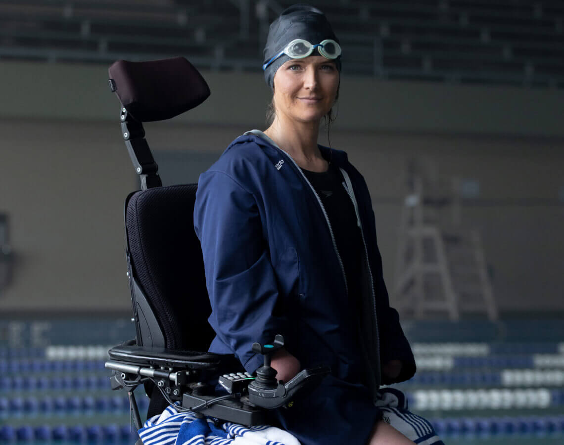 Aimee smiling to the camera